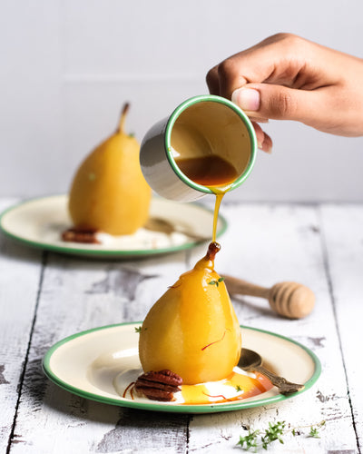 poached pear and pouring of honey